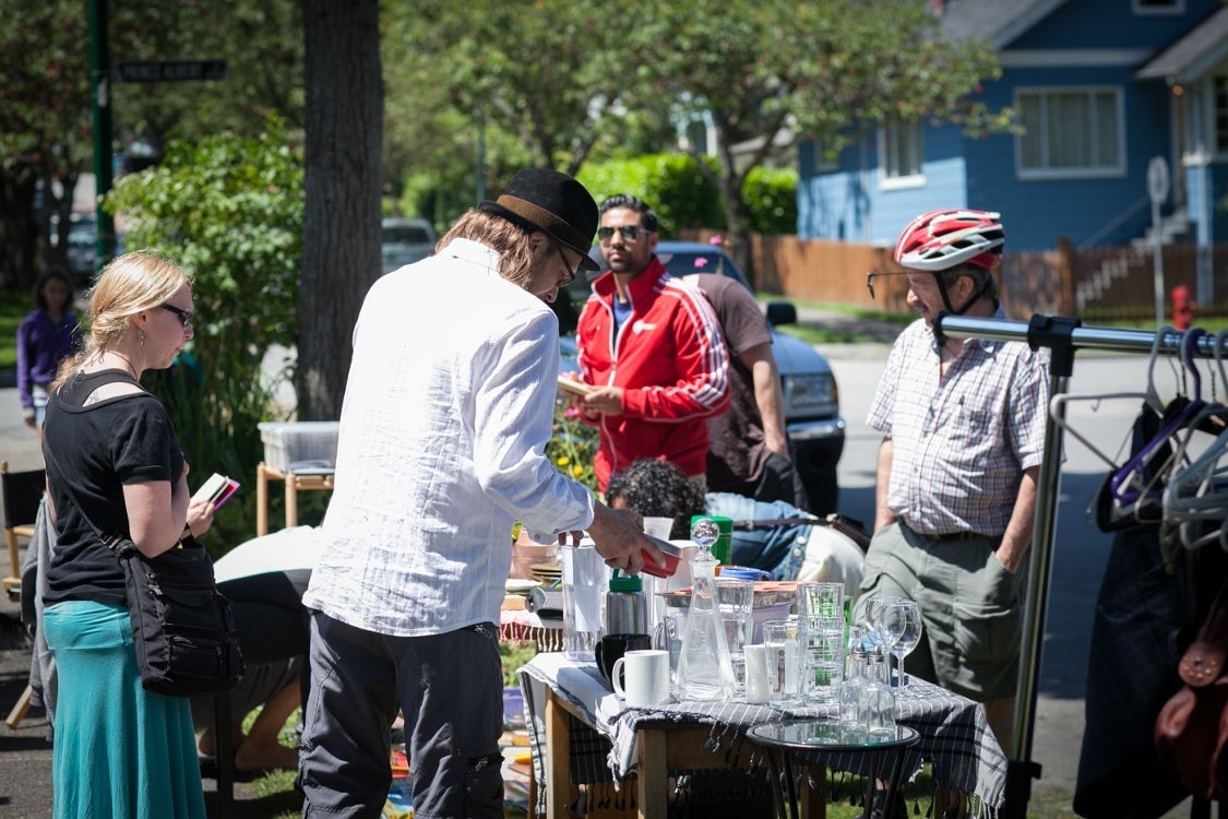 Buyers and sellers of all ages participate in the 2nd annual community yard sale in Mount Pleasant.  Organized by Teresa Comeau, Remax Real Estate Agent